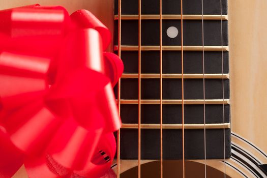 Guitar Strings with Red Ribbon - The Gift of Music.