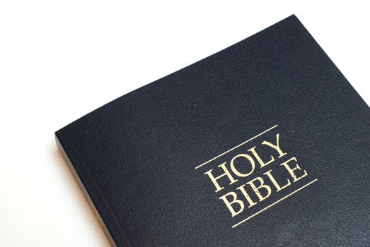 The holy bible over a white background.