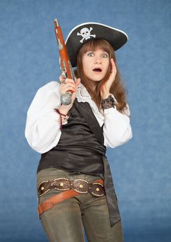 Strongly frightened woman in a costume of the sea pirate