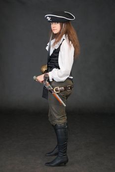 The sea pirate with the weapon on a black background