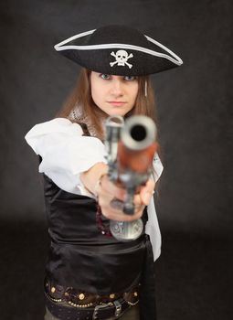 The woman - the pirate aims in us from an ancient pistol