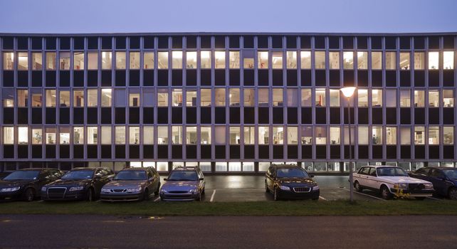 Office building with a dark bly sky in the background