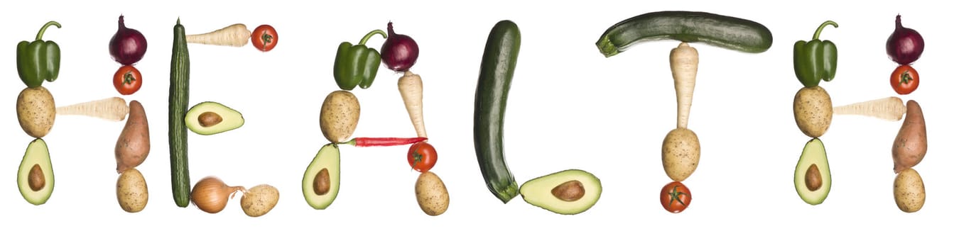 The word 'health' made out of vegetables isolated on a white background