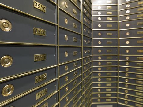 Rows of luxurious safe deposit boxes in a bank vault