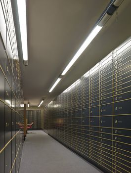 Rows of luxurious safe deposit boxes in a bank vault