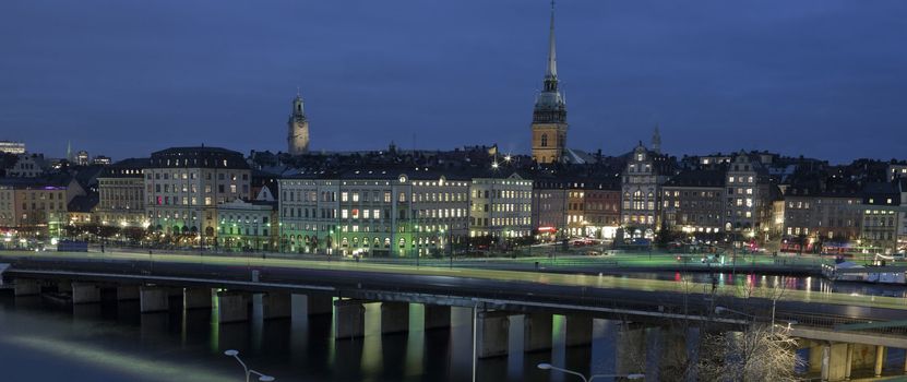 City skyline with cars and metro in motion