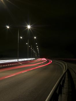 Traffic in movement on a bridge at night