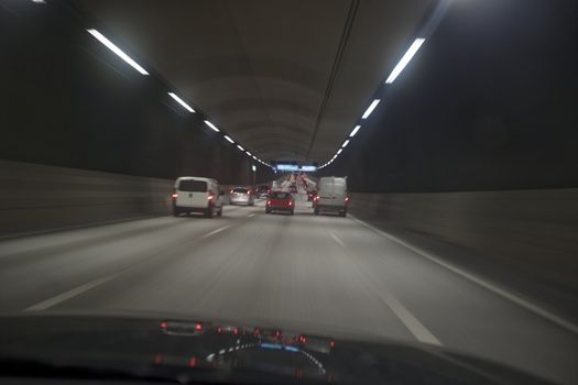 Man driving through a tunnel at night time