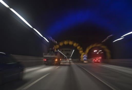 Man driving through a tunnel at night time