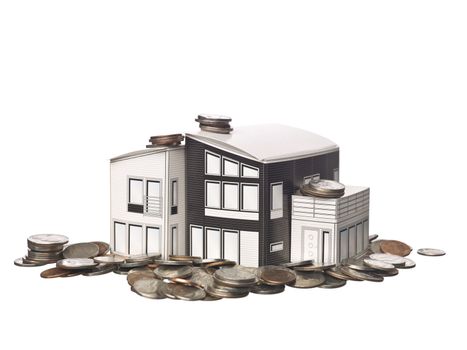 House model standing on american coins isolated on a white background