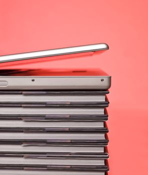 Laptop on top of a pile of books