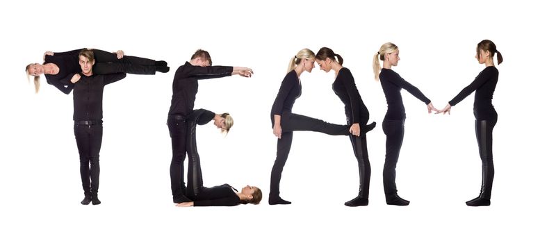 Group of people forming the word 'TEAM', isolated on white background.