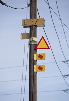Warning signs on a electricity pylon with short focal depth