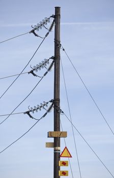 Warning signs on a electricity pylon with short focal depth