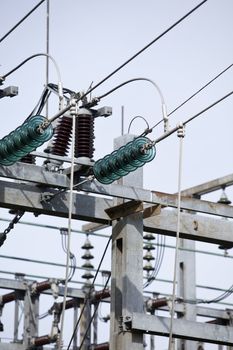 Close up on a power cable with a blue sky background.