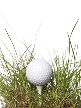 Golf ball on green grass isolated on a white background