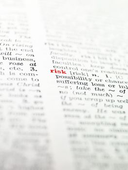 The word 'risk' highlighted in a dictionary