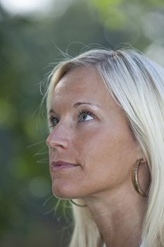 Portrait of a blonde woman smiling.