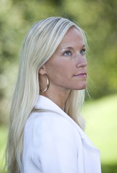 Portrait of a blonde woman smiling.