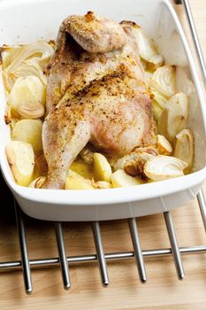 chicken baked with onion and potatoes