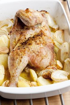 chicken baked with onion and potatoes