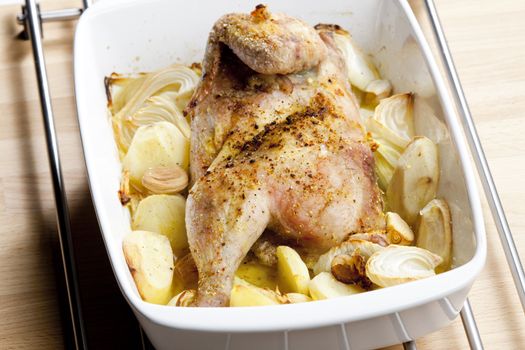 chicken baked with onion and potatoes