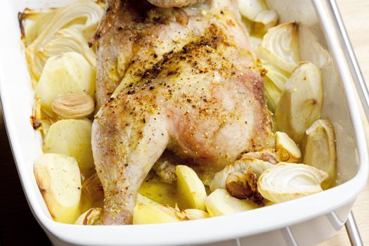 chicken baked with onion and potatoes