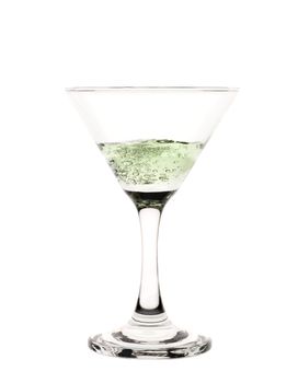 A cocktail glass with green liquid in it. 
