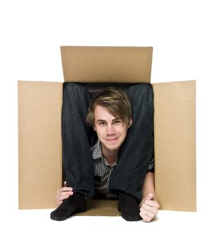 Acrobat inside of a cardboard box.