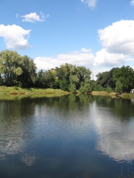 summer rural landscape with forest and river