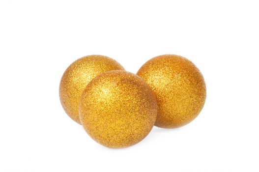 Three golden yellow christmas balls isolated on white