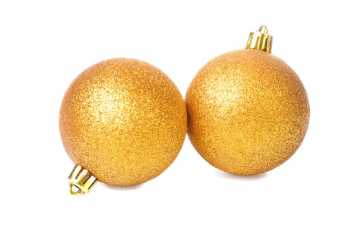 two golden yellow Christmas balls Isolated on white