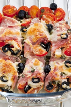 baked ham rolls filled with chicken meat and black olives