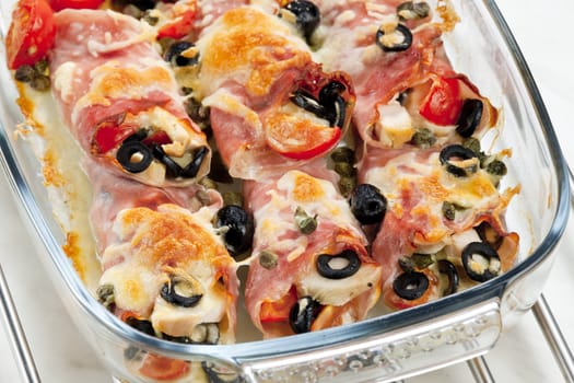 baked ham rolls filled with chicken meat and black olives