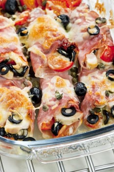 baked ham rolls filled with chicken meat and black olives