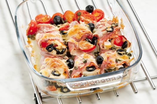 baked ham rolls filled with chicken meat and black olives