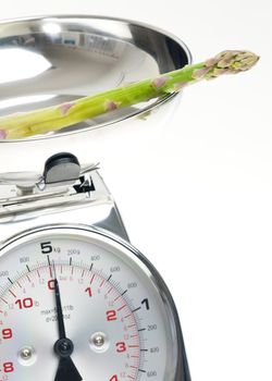green asparagus on kitchen scales