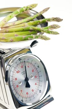 green asparagus on kitchen scales