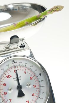 green asparagus on kitchen scales