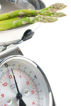 green asparagus on kitchen scales