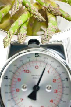 green asparagus on kitchen scales