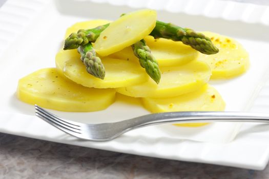 cooked potatoes with green asparagus