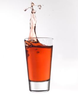 Splash in a glass of red lemonade