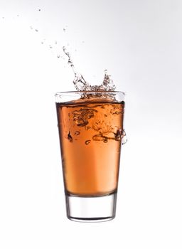 Splash in a glass of red lemonade