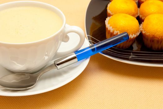Closeup of coffee with milk in white cup
