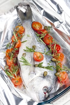 raw bream with herbs and cherry tomatoes