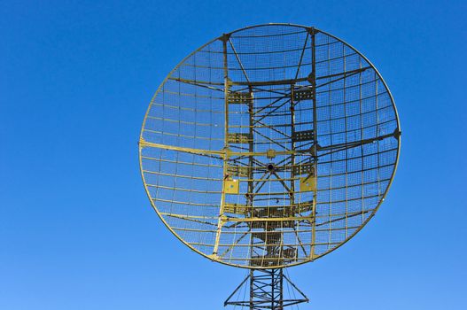 Military radar station against the clear blue sky