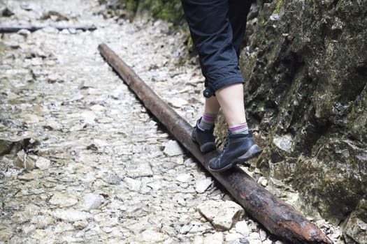 girl walking across the mountain stream - Slovak Paradise