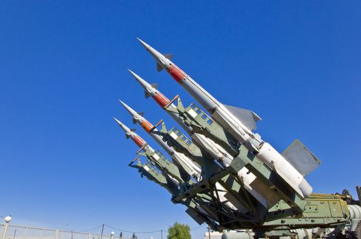 Antiaircraft rockets on the launcher against blue sky.