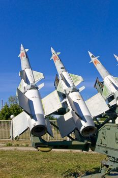 Antiaircraft rockets on the launcher against blue sky.